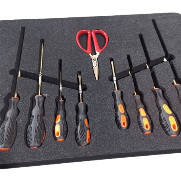 Custom die-cut foam insert holding tools in a case