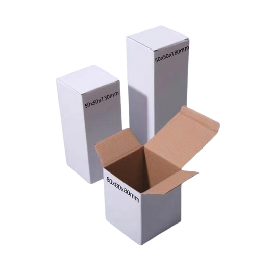 Custom white paperboard packaging boxes in multiple product sizes